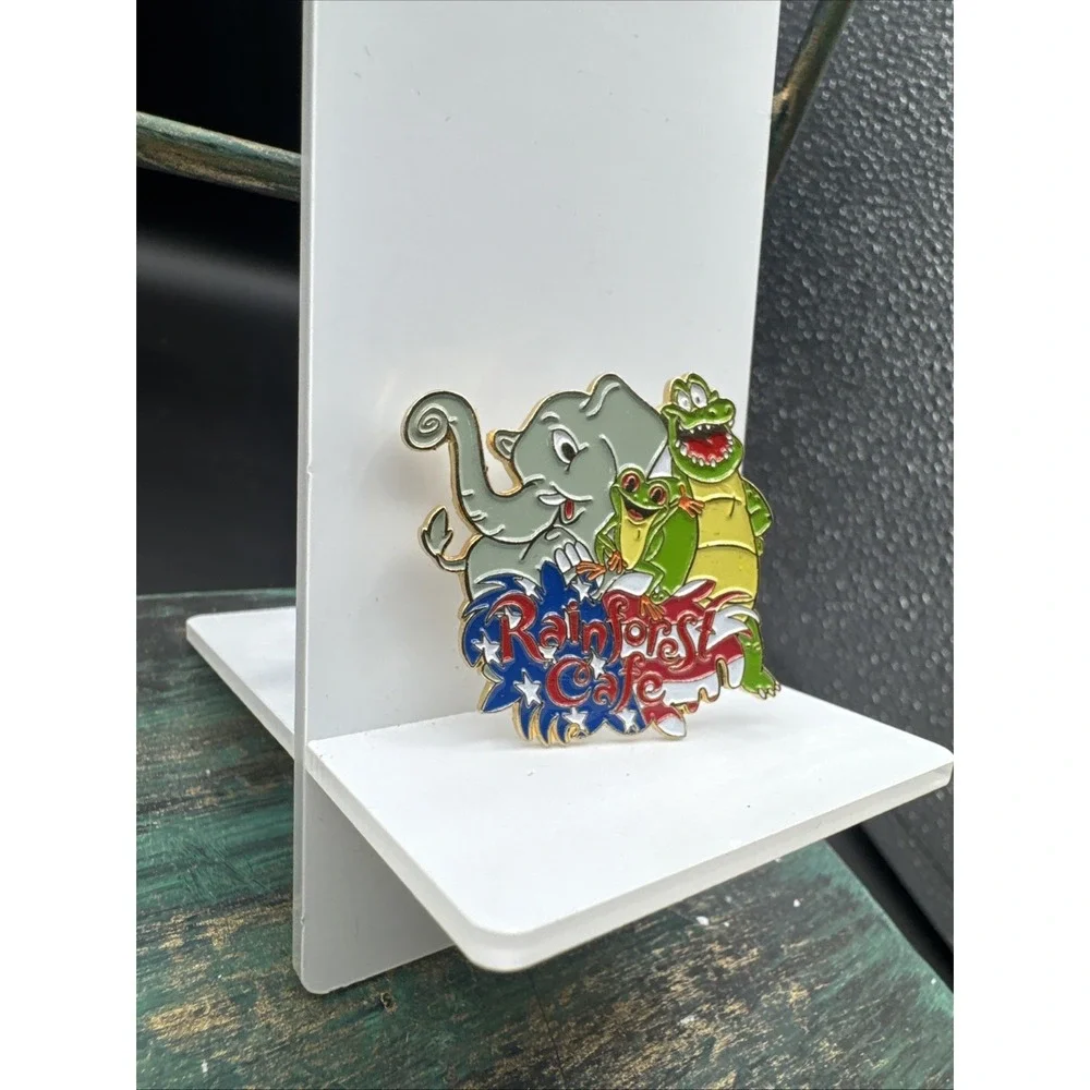 Rainforest Cafe Pin Featuring Nike, Cha Cha, Tuki American Flag